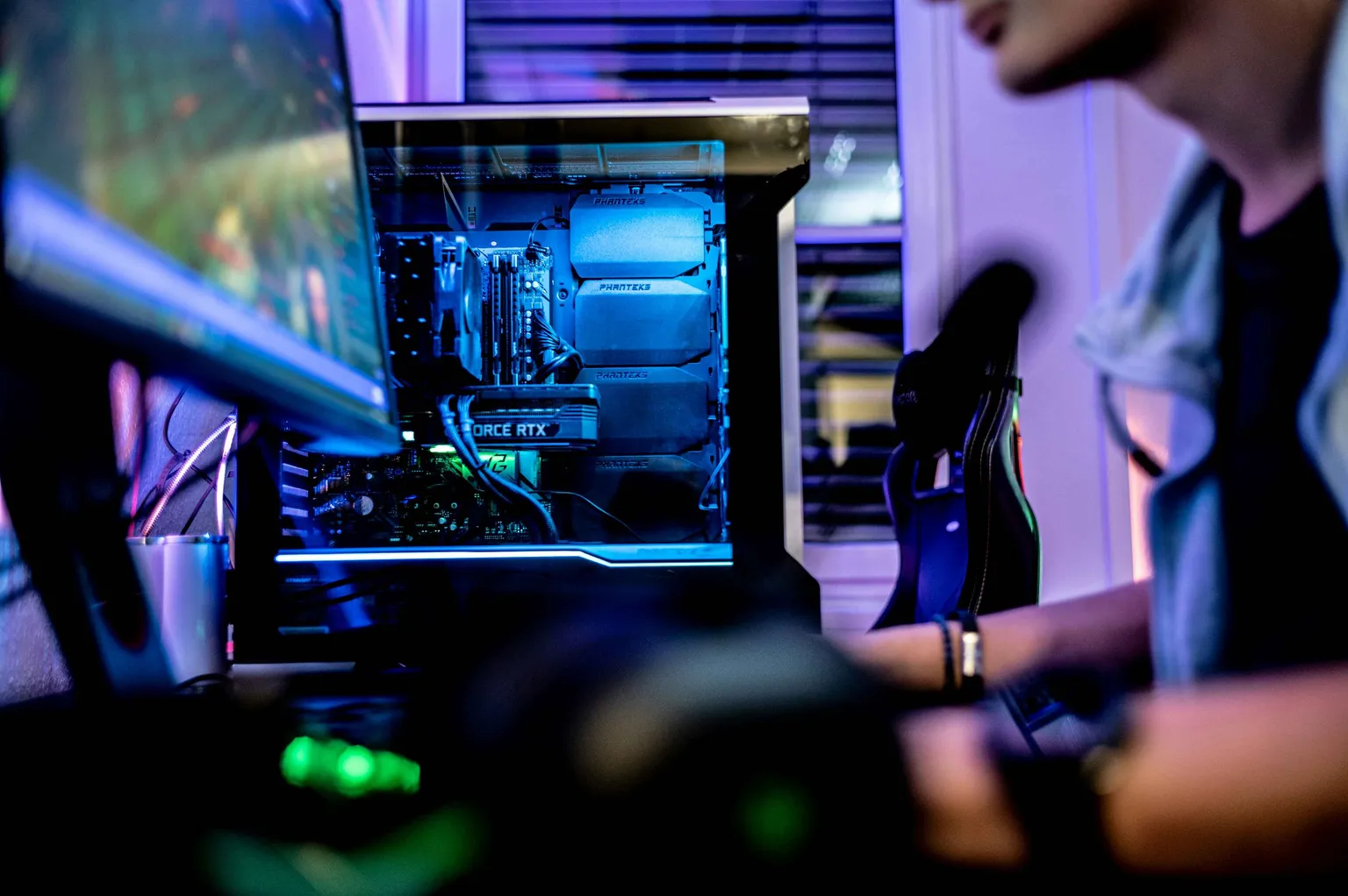 Guy playing a game on a PC